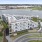 Aerial view of Gibson Point apartments exterior overlooking the waterfront with nearby tennis courts in Revere, Massachusetts
