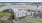 Aerial view of Gibson Point apartments exterior overlooking the waterfront with nearby tennis courts in Revere, Massachusetts