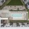 Aerial view of the courtyard with pool, lounge areas, and green space at Gibson Point apartments in Revere, Massachusetts
