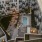 Evening view of the courtyard with pool, lounge seating, and string lights at Gibson Point apartments in Revere, Massachusetts