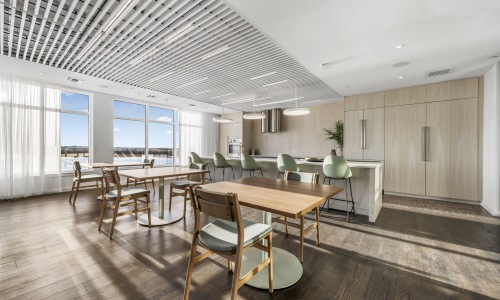 Modern Resident Lounge and Chef’s Kitchen at Gibson Point | Coastal Living in Revere, MA Stylish resident lounge at Gibson Point in Revere, MA with designer furnishings, natural wood finishes, and a chef-inspired demonstration kitchen overlooking the water